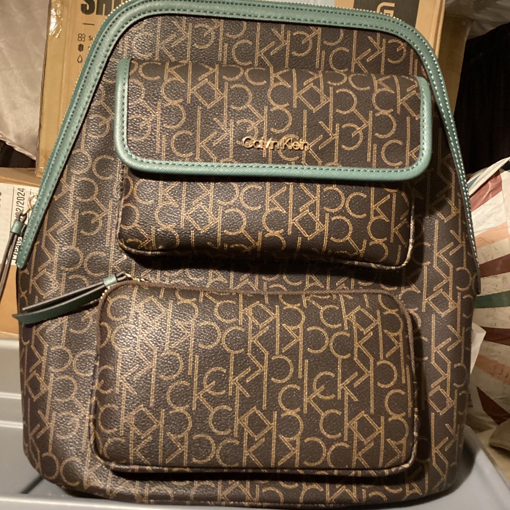 Calvin Klein logo backpack purse with green accents MSRP $178.00